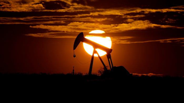 The sun sets behind an idle pump jack near Karnes City, Texas, Wednesday, April 8, 2020. Demand for oil continues to fall due to the new coronavirus outbreak.