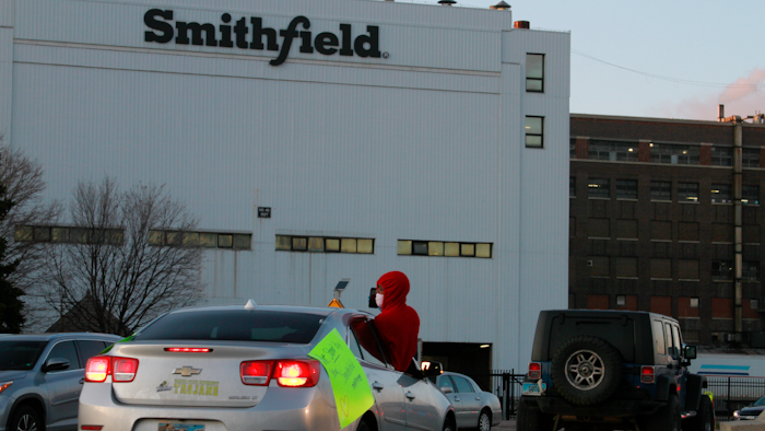 In this April 9, 2020 file photo employees and family members protest outside a Smithfield Foods processing plant in Sioux Falls, S.D.