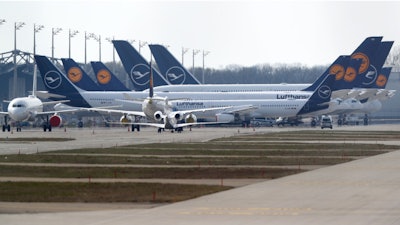 Lufthansa planes parked at the airport in Munich, March 26, 2020.