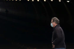 A man wears a mask while crossing in front of the Stockton Street Tunnel in San Francisco, Sunday, March 29, 2020.