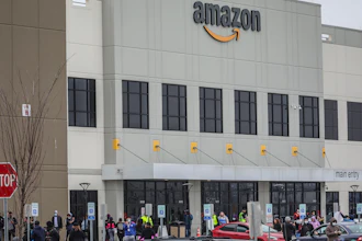 In this March 30, 2020 file photo, workers at Amazon's fulfillment center in Staten Island, N.Y., gather outside to protest work conditions in the company's warehouse in New York. Amazon fired a worker who staged the walkout to demand greater protection against the new coronavirus, saying the employee himself flaunted distancing rules and put others at risk. The decision prompted a rebuke from New York Attorney General Letitia James, who called on the National Labor Relations Board to investigate.