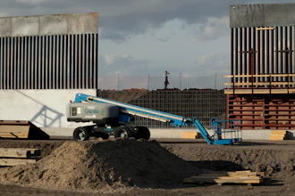 In this Nov. 7, 2019, file photo, the first panels of levee border wall are seen at a construction site along the U.S.-Mexico border, in Donna, Texas.