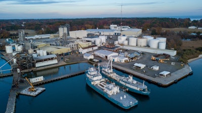 This Nov. 26, 209 file photo shows Omega Protein's menhaden processing plant on Cockrell's Creek in Reedville, Va., The company that makes fish-oil supplements will keep its certification for sustainable fishing despite defiance of catch limits in the Chesapeake Bay. The Marine Stewardship Council’s sustainability marker is prominently displayed on seafood packages in grocery stores. It means that a company catches fish from a healthy population and leaves little impact on the food chain, among other factors.