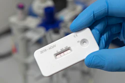 A scientist presents an antibody test for coronavirus in a laboratory of the Leibniz Institute of Photonic Technology (Leibniz IPHT) at the InfectoGnostics research campus in Jena, Germany, Friday, April 3, 2020.