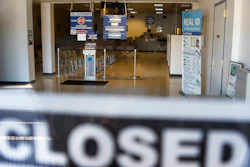 In this April 3, 2020, file photo, the seats and aisles are empty as seen through the window of the closed Penndot Drivers License Center in Butler, Pa.