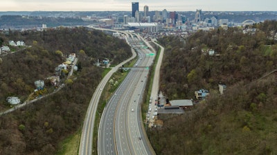 A stay-at-home order in response to the new coronavirus has meant little traffic on Pittsburgh's busiest streets, as seen with this sparse assortment of cars on the Parkway North during rush hour on Tuesday, April 7, 2020, in Pittsburgh.