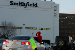 In this April 9, 2020 file photo employees and family members protest outside a Smithfield Foods processing plant in Sioux Falls, S.D.