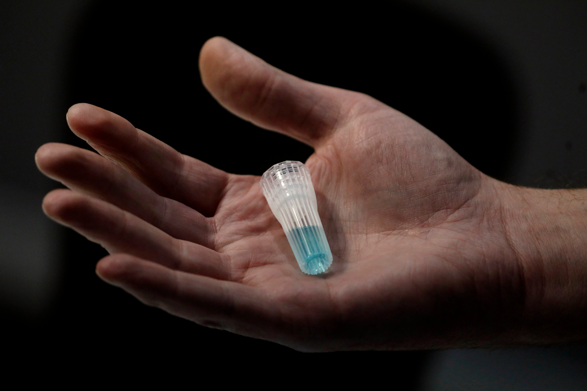 In this April 3, 2020, photo, blue preservation solution is shown at Spectrum DNA in Draper, Utah. The company has developed a test kit to detect the coronavirus in patients' saliva. At least two Utah companies have developed tests and gotten emergency authorization from the U.S. Food and Drug Administration: molecular diagnostics company Co-Diagnostics and ancestry-testing kit maker Spectrum DNA.