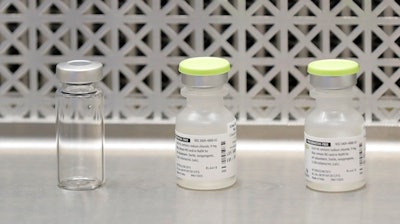 This March 16, 2020 file photo shows vials used by pharmacists to prepare syringes used on the first day of a first-stage safety study clinical trial of the potential vaccine for COVID-19.