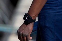 Deckhand Gerard Bakulikira wears a Romware COVID Radius digital bracelet at the Port of Antwerp, Belgium, April 22, 2020.