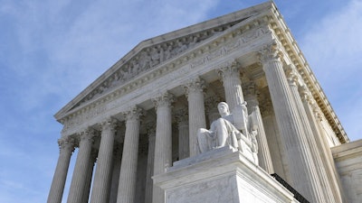 In this Nov. 11, 2019 file photo, a view of the Supreme Court in Washington. The Supreme Court has delivered a setback to Montana homeowners who are seeking additional cleanup of arsenic left over from years of copper smelting. The court said Monday that the homeowners cannot proceed with efforts to decontaminate their own property near the shuttered Anaconda smelter without the permission of the Environmental Protection Agency.