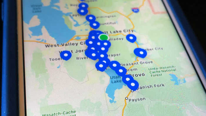 This April 28, 2020, photo shows a smartphone app built for the state of Utah displaying coronavirus test sites. The app tracks symptoms and shares location data for contact tracing, the process of determining who might have been exposed to the virus. The app is “a tool to help jog the memory of the person who is positive so we can more readily identify where they’ve been, who they’ve been in contact with, if they choose to allow that,” said Angela Dunn, Utah’s state epidemiologist.