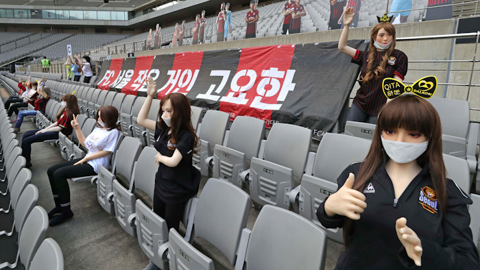 In this May 17, 2020, photo, cheering mannequins are installed at the empty spectators' seats before the start of a soccer match between FC Seoul and Gwangju FC at the Seoul World Cup Stadium in Seoul, South Korea. A South Korean professional soccer club has apologized after being accused of putting sex dolls in empty stands during a match Sunday in Seoul. In a statement, FC Seoul expressed 'sincere remorse' over the controversy, but insisted that it used mannequins, not sex dolls, to mimic a home crowd during its 1-0 win over Gwangju FC at the Seoul World Cup stadium.