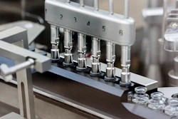 Rubber stoppers are placed onto filled vials of the investigational drug remdesivir at a Gilead manufacturing site, March 2020.