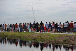 Spectators watch the space shuttle Atlantis lift off from the Kennedy Space Center at Cape Canaveral, Fla., July 8, 2011.