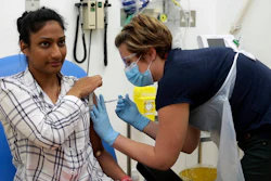 A volunteer is injected as part of a vaccine trial in a video issued by Oxford University, April 25, 2020.