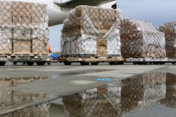 Pallets of medical personal protective equipment are unloaded from a Chinese cargo plane at Los Angeles International Airport, April 10, 2020.