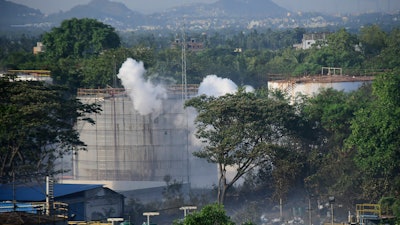 Smoke rises from LG Polymers plant, the site of a chemical gas leakage, in Vishakhapatnam, India.