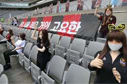 In this May 17, 2020, photo, cheering mannequins are installed at the empty spectators' seats before the start of a soccer match between FC Seoul and Gwangju FC at the Seoul World Cup Stadium in Seoul, South Korea. A South Korean professional soccer club has apologized after being accused of putting sex dolls in empty stands during a match Sunday in Seoul. In a statement, FC Seoul expressed 'sincere remorse' over the controversy, but insisted that it used mannequins, not sex dolls, to mimic a home crowd during its 1-0 win over Gwangju FC at the Seoul World Cup stadium.