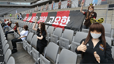 In this May 17, 2020, photo, cheering mannequins are installed at the empty spectators' seats before the start of a soccer match between FC Seoul and Gwangju FC at the Seoul World Cup Stadium in Seoul, South Korea. A South Korean professional soccer club has apologized after being accused of putting sex dolls in empty stands during a match Sunday in Seoul. In a statement, FC Seoul expressed 'sincere remorse' over the controversy, but insisted that it used mannequins, not sex dolls, to mimic a home crowd during its 1-0 win over Gwangju FC at the Seoul World Cup stadium.