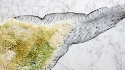 A rug by Dutch designer Nienke Hoogvliet, who weaves seaweed into rugs, chairs and tables in her Sea Me Collection.