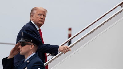 President Donald Trump boards Air Force One as he departs Thursday, May 21, 2020, at Andrews Air Force Base, Md. Trump will visit a Ypsilanti, Mich., Ford plant that has been converted to making personal protection and medical equipment.