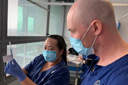 Technicians prepare for a clinical trial of a vaccine in Melbourne, Australia, May 26, 2020.
