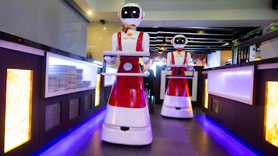 Robots at the Hu family's Royal Palace restaurant in Renesse, Netherlands, May 27, 2020.