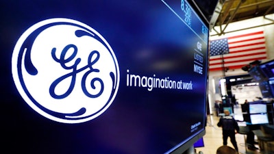 In this Aug. 16, 2019, file photo the logo for General Electric appears above a trading post on the floor of the New York Stock Exchange.