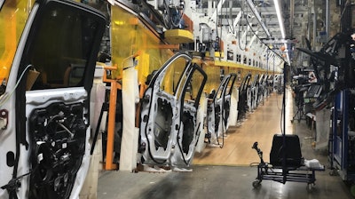Weld curtains hang across the door line at FCA’s Sterling Heights (Mich.) Assembly Plant to protect employees from the spread and transmission of COVID-19.