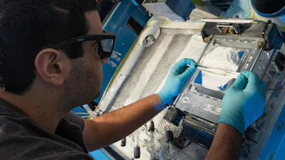 Graduate student Ian Kinstlinger prepares the selective laser sintering system in the Miller bioengineering lab at Rice University. Kinstlinger uses the system to 3D-print blood vessel templates from powdered sugar. The templates allow bioengineers to make lab-grown tissues that have sufficient blood flow to sustain densely packed cells.