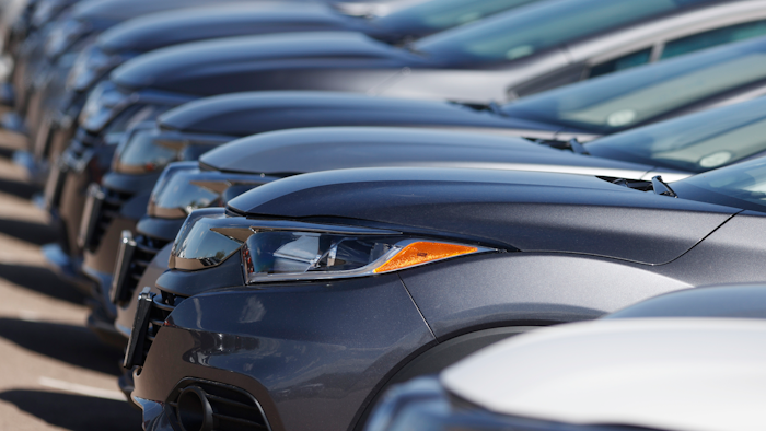 In this file photo dated Sunday, June 7, 2020, a long row of unsold cars at a Honda dealership in Highlands Ranch, USA.
