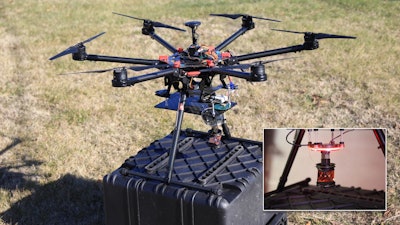 A UAS outfitted with both a marker strobe (inset) and a traditional survey prism used to evaluate the accuracy of the motion-capture system.