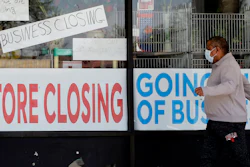 Signs at a closed store in Niles, Ill., May 21, 2020.