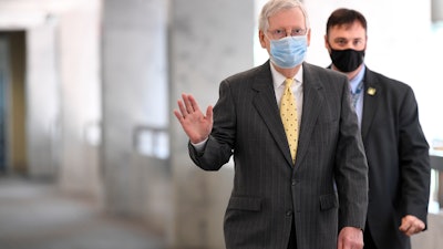 Senate Majority Leader Mitch McConnell arrives for a Republican luncheon on Capitol Hill, June 4, 2020.