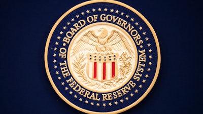 In this July 31, 2019 file photo, The Federal Reserve logo is shown before the start of a scheduled news conference by Chairman Jerome Powell when it ends its latest policy meeting in Washington.