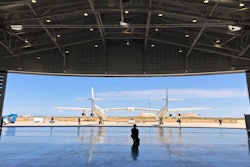 In this Aug. 15, 2019 file photo, Virgin Galactic ground crew guide the company's carrier plane into the hangar at Spaceport America following a test flight over the desert near Upham, New Mexico. Virgin Galactic Holdings Inc. has agreed to a deal with NASA to boost commercial human spaceflight to the International Space Station and develop a “robust economy” in space.