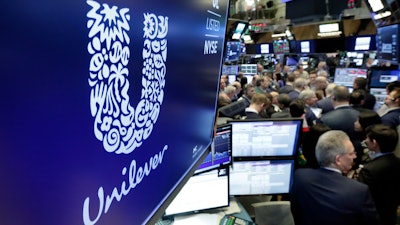 In this Thursday, March 15, 2018 file photo, the logo for Unilever appears above a trading post on the floor of the New York Stock Exchange.