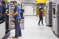 General Motors additive manufacturing team members working at the still-under-construction Additive Innovation Center.