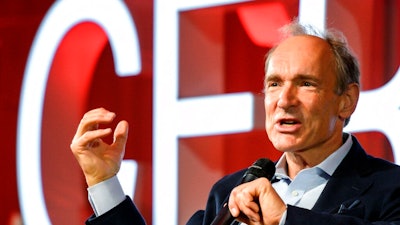 In this March 12, 2019, file photo, English computer scientist Tim Berners-Lee, best known as the inventor of the World Wide Web, delivers a speech during an event at the CERN in Meyrin near Geneva, Switzerland, marking 30 years of World Wide Web. Berners-Lee said Thursday, June 11, 2020 the COVID-19 pandemic demonstrates “the gross inequality” of a world where almost half the population is unable to connect, telling a high-level U.N. meeting “our number one focus must be to close the digital divide.”