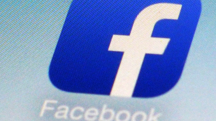 Facebook app icon on a smartphone in New York, Feb. 19, 2014.
