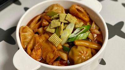 In this July 3 photo, provided by Lee Hyun Su, pieces of new green onion flavored Chex cereal are sprinkled on a bowl of Tteok-bokki, or stir-fried rice cakes, a popular Korean dish in Seoul, South Korea. The cereal has become a sensation in South Korea after 16 years of delay in its release.