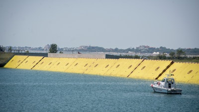 Moveable flood gates rise from the sea in the Venice lagoon, July 10, 2020.