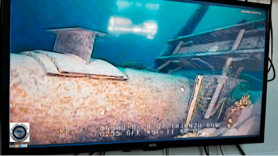 This June 2020 file photo, shot from a television screen provided by the Michigan Department of Environment, Great Lakes, and Energy shows damage to anchor support EP-17-1 on the east leg of the Enbridge Line 5 pipeline within the Straits of Mackinac in Michigan. Michigan Gov. Gretchen Whitmer criticized Enbridge Inc. on Wednesday, July 22, 2020 for what she described as the company's refusal to make an airtight pledge that it would pay for any damages caused by an oil spill from its pipeline beneath a Great Lakes waterway.