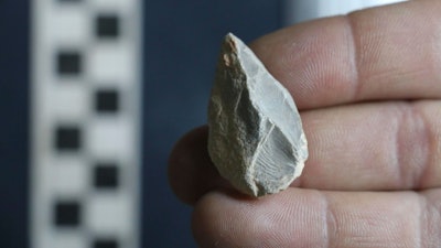 This undated photo provided by Ciprian Ardelean in July 2020 shows a stone tool found below the Last Glacial Maximum layer from a cave in Zacatecas, central Mexico. Artifacts from the cave suggest people were living in North America much earlier than most scientists think. Researchers reported Wednesday, July 22, 2020, that the tools date to as early as 26,500 years ago, about 10,000 years before the generally accepted date for the earliest human presence in North America.