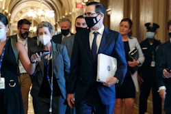 Treasury Secretary Steven Mnuchin , center, walks to a Republican luncheon on Capitol Hill, July 21, 2020.