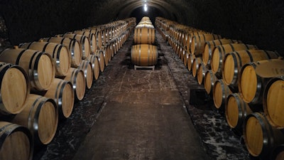 Empty barrels for the next harvest in autumn in the cave of Champagne producer Anselme Selosse in Avize, in the Champagne region east of Paris, on July 28.