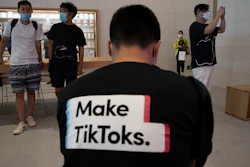 A man wearing a shirt promoting TikTok at an Apple store in Beijing, July 17, 2020.