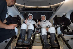 The SpaceX Crew Dragon Endeavour spacecraft is lifted onto the SpaceX GO Navigator recovery ship shortly after it landed with NASA astronauts Robert Behnken and Douglas Hurley onboard in the Gulf of Mexico.