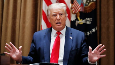 President Donald Trump speaks during a meeting with U.S. tech workers.